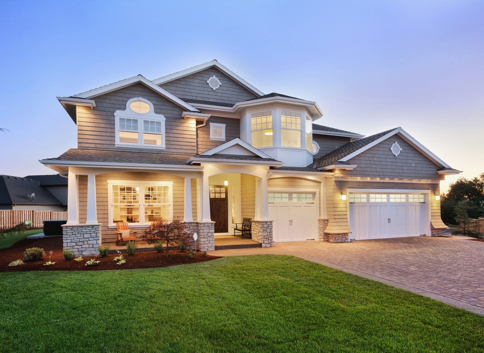 Home exterior with new windows and siding